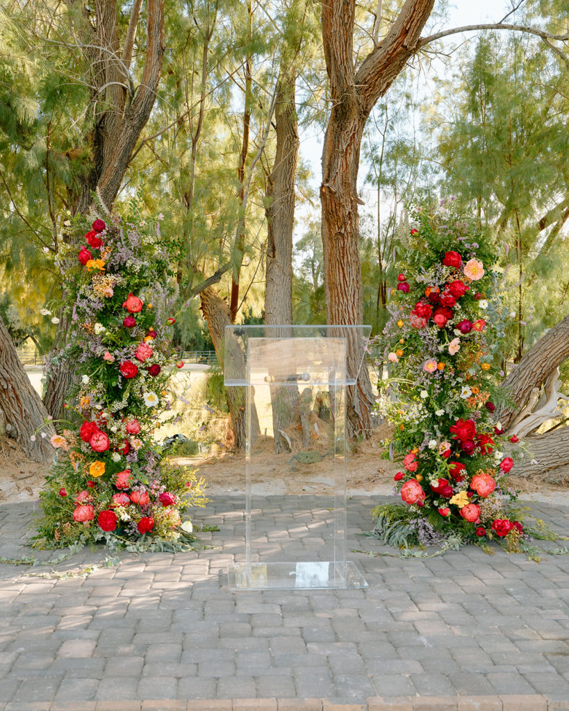 altar with vibrant flower pillars