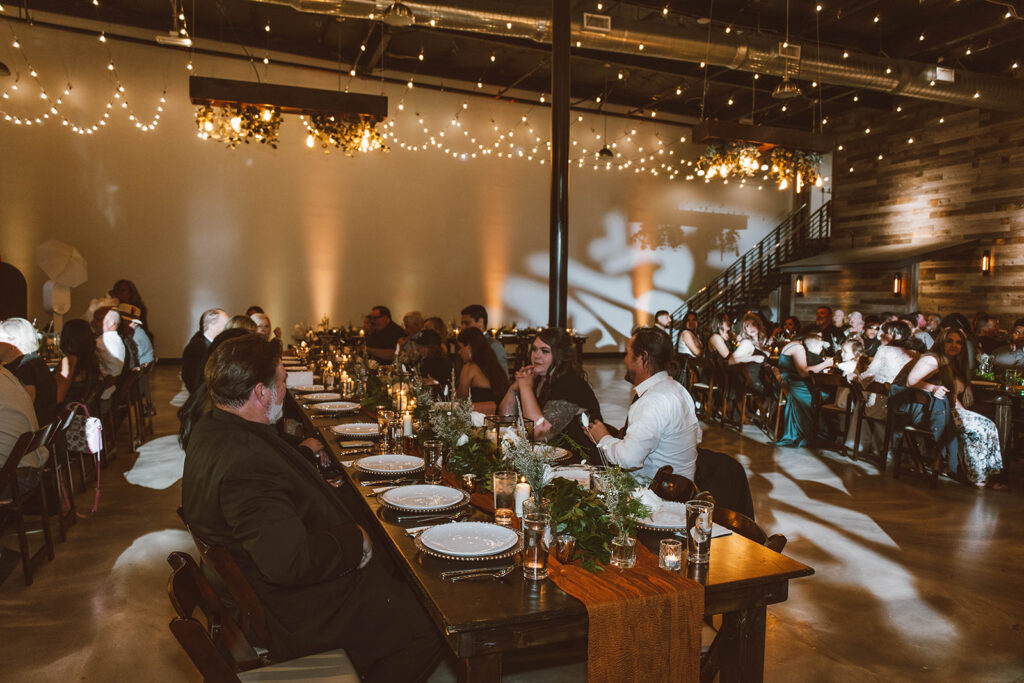 Gorgeous photo of the elopement location: A Simple Affair, High ceilings, string lighting and rustic feel