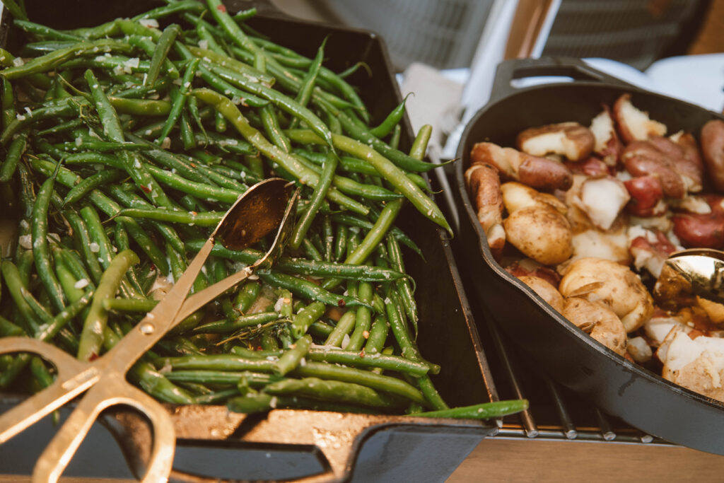 green beans and potatoes dinner pictured in serving trays